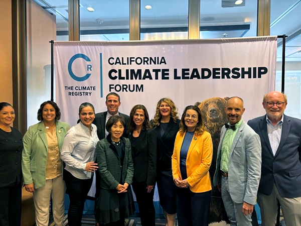 Senator Wahab standing in photo with Senate colleagues attending Climate Week. 